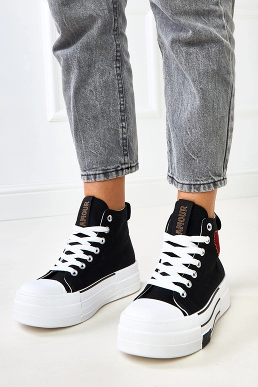 Schwarze hohe Plattform-Sneaker mit... Schwarze hohe Plattform-Sneaker mit...