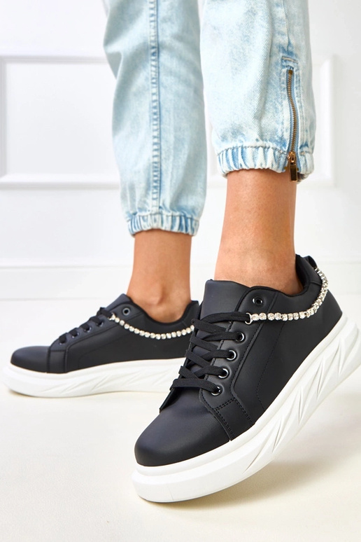Schwarze Sneakers auf Plattform mit... Schwarze Sneakers auf Plattform mit...