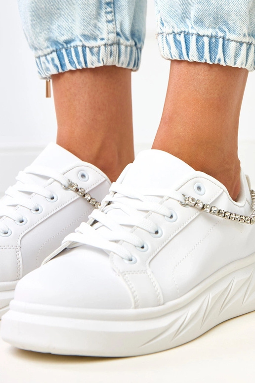 Weiße Plateausneaker mit dekorativer... Weiße Plateausneaker mit dekorativer...