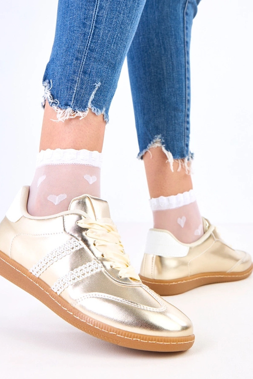 Gouden dames sneakers met satijnen...