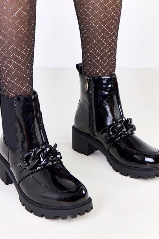 Zwarte lakleren laarzen versierd met...