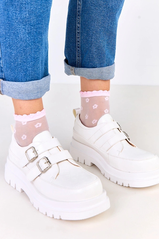 Bottines blanches sur semelle...