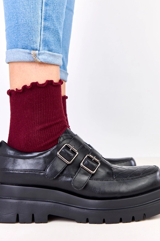 Bottines noires sur semelle massive,...