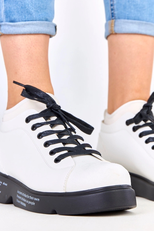 Bottines blanches avec motif sur la...