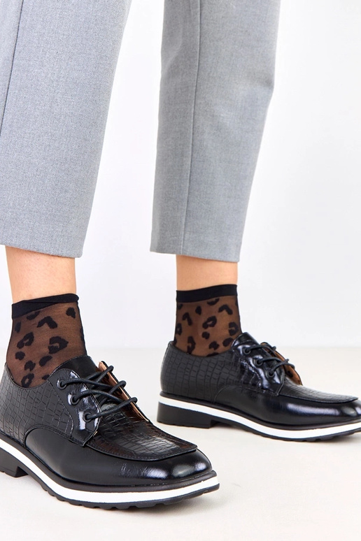 Schwarze Halbschuhe mit Prägung und...