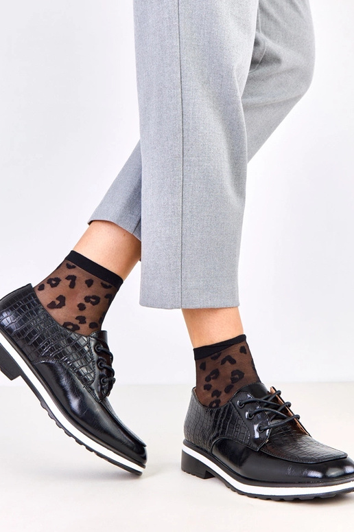 Bottines noires avec embossage et...