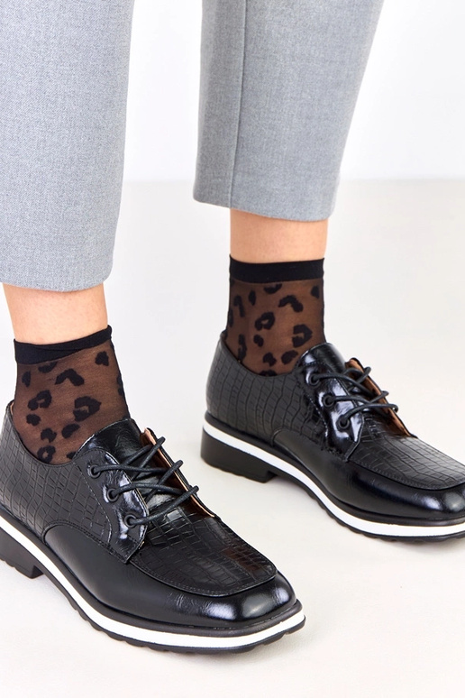 Zwarte halfhoge schoenen met reliëf...