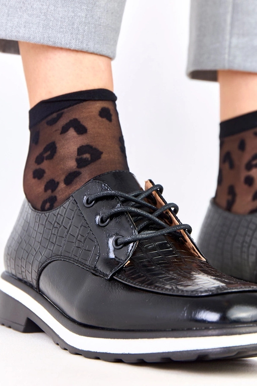 Schwarze Halbschuhe mit Prägung und...