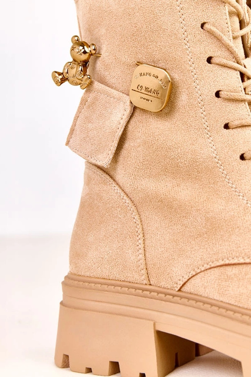 Beige laarzen versierd met een...