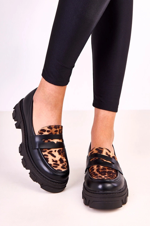 Mocassins noirs avec accent à motif...