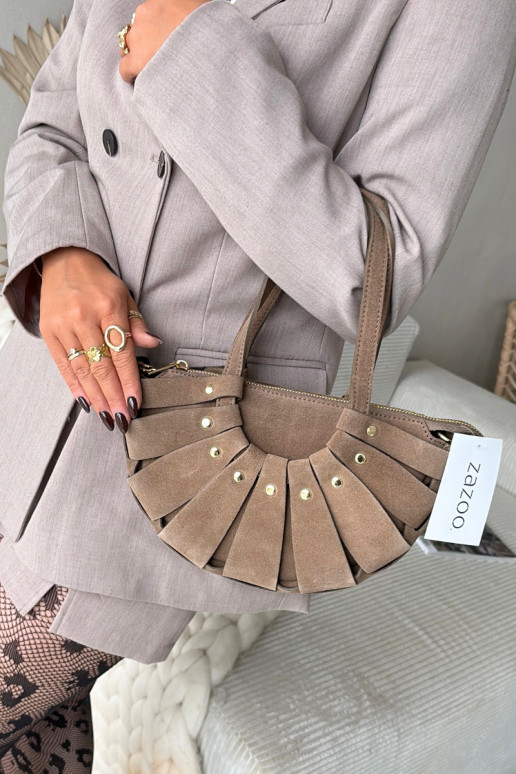 HandheldErmöglichtturalnego aus INildlederu elfenbeinfarbe Es mussrivane