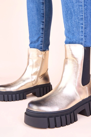 Bottines dorées sur...