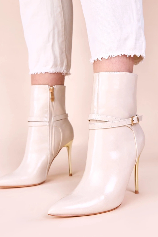 Bottines sable sur talon doré avec...