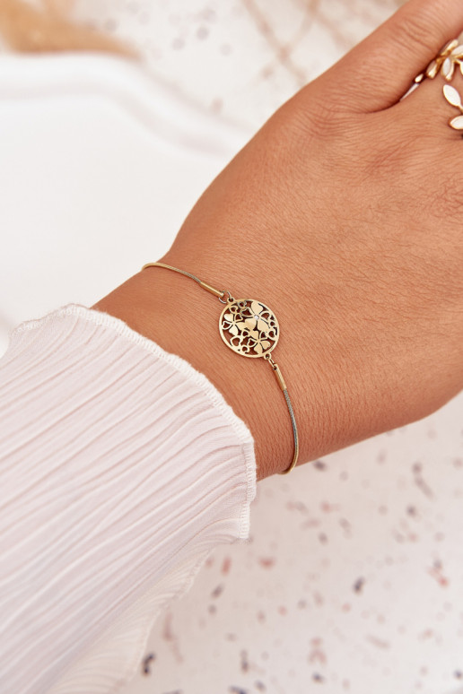 Un bracelet Féminin Avec pendentif Kółkoavec des motifs florauxuszkami couleur dorée