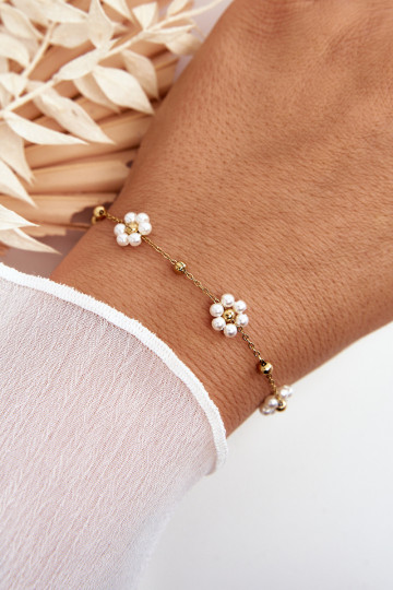 À la mode Un bracelet Avec des fleurs blanches couleur dorée