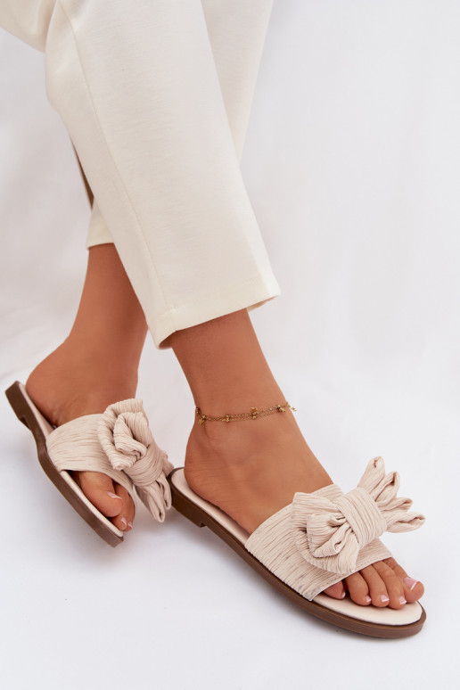 Dames slippers met brede hakken en strikken in zandkleur Amivelle