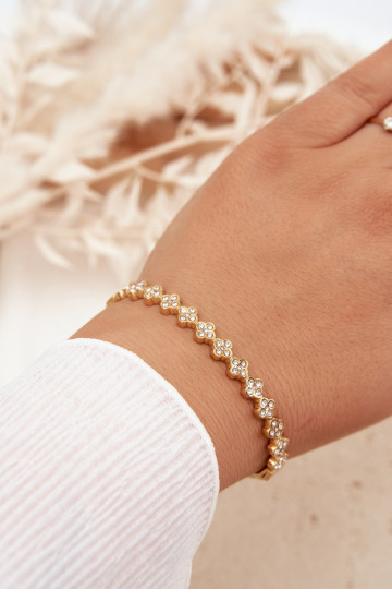 Damenarmband mit funkelnden Steinen in goldfarben