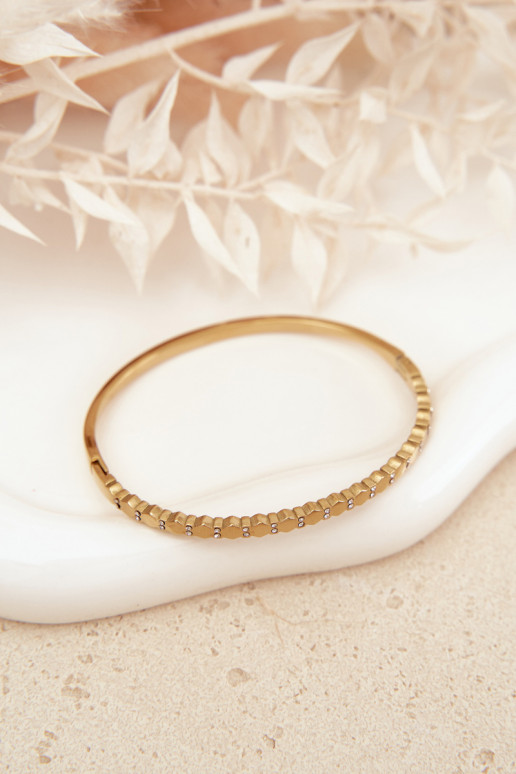 Un bracelet FémininPetitmet des zircons Stal NierdzeÀna couleur dorée