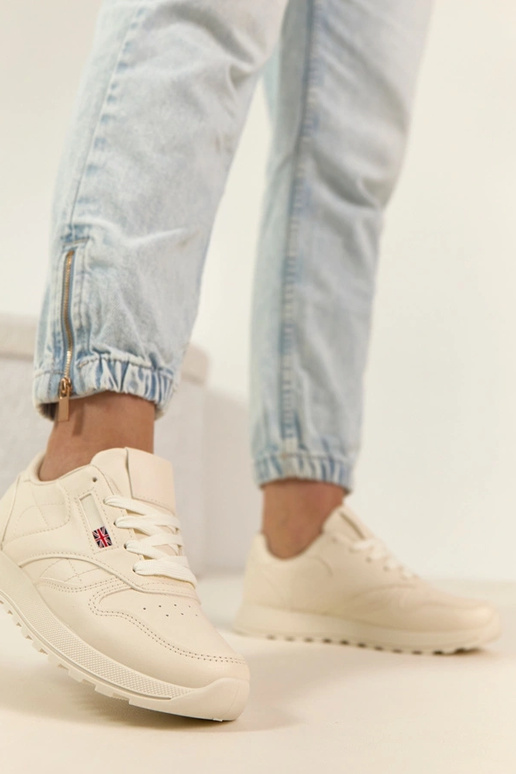 Helle sandfarbene Alltagssneaker mit...