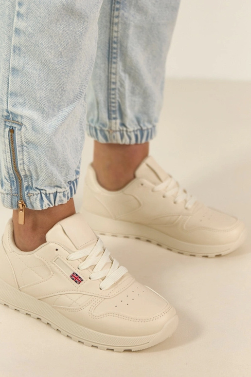 Helle sandfarbene Alltagssneaker mit...