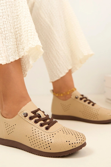 Sandfarbene Lochmuster... 2