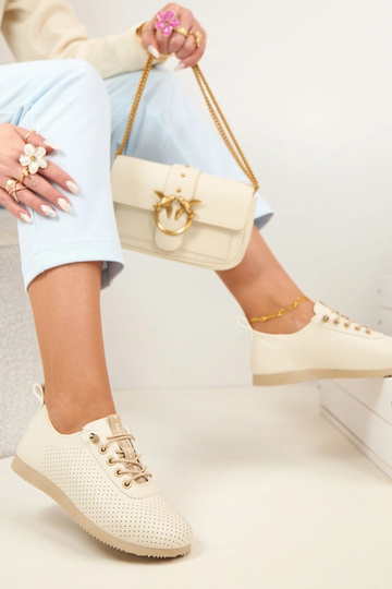 Zandkleurige geperforeerde...