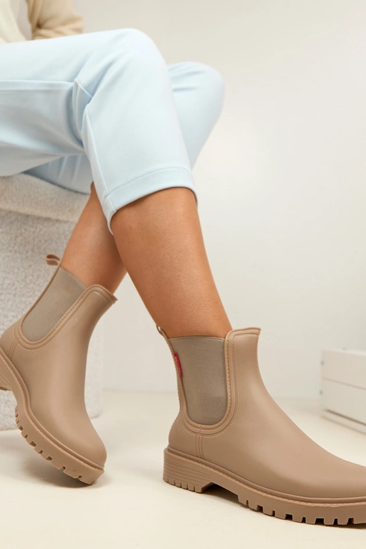 Donker zandkleurige rubberen laarzen...