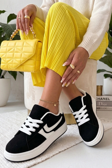 Zwarte sneakers met... 2