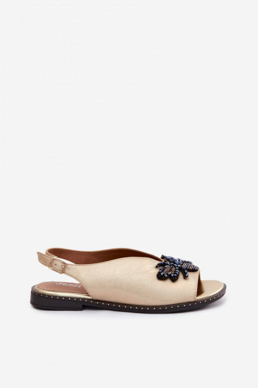 Sandalen mit Glanz und Ornamenten in flachem Gold Russona