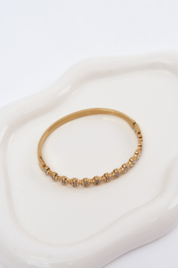 Gouden damesarmband met fonkelende steentjes