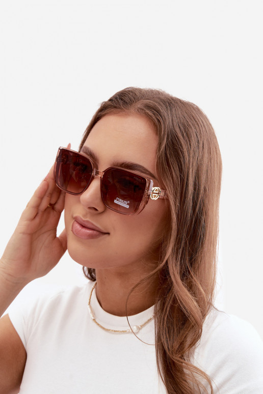 Lunettes de soleil avec des détails décoratifs en couleur rose