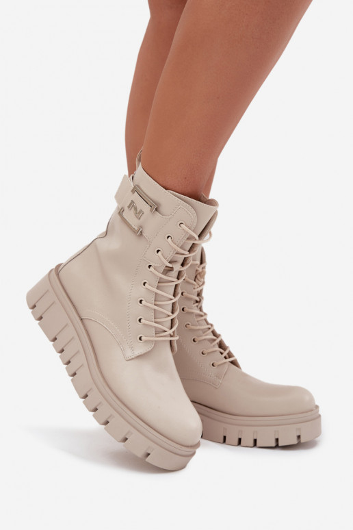 Bottines isolées avec plateforme et détails décoratifs en ivoire Lyrana