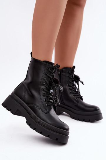 bottes isolées avec pompons en noir Faresse