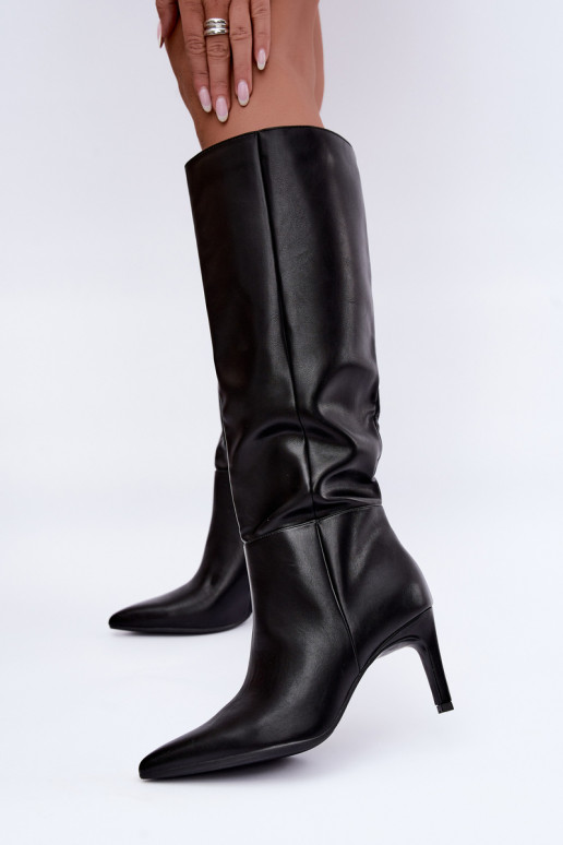 Bottes chaudes jusqu'au genou avec volants et talons en noir Rodeline