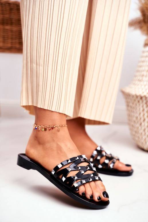 Chaussons en caoutchouc noir avec rivets