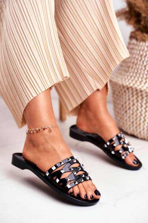 Chaussons en caoutchouc noir avec rivets