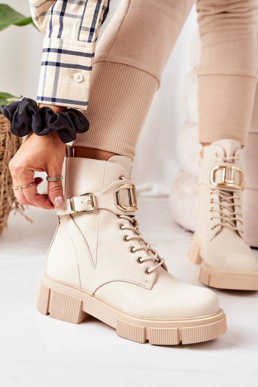 Bottes chauffantes à boucles dorées en beige