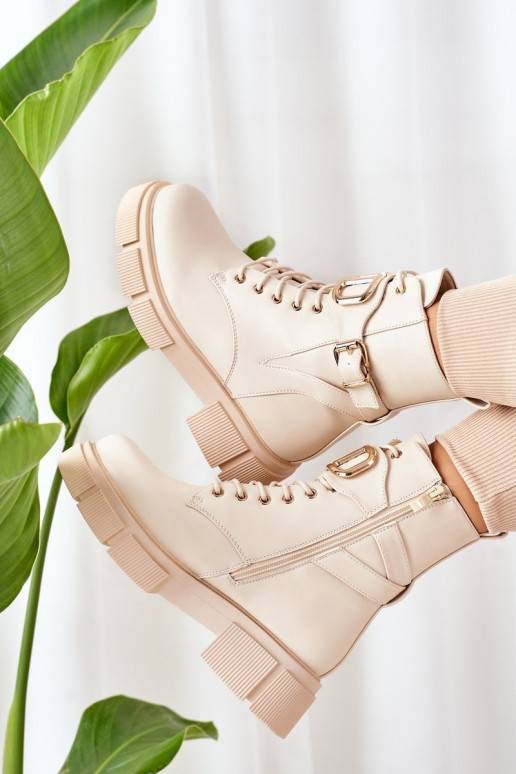 Bottes chauffantes à boucles dorées en beige
