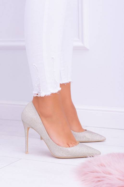 Chaussures à talons hauts brillantes de couleur dorée