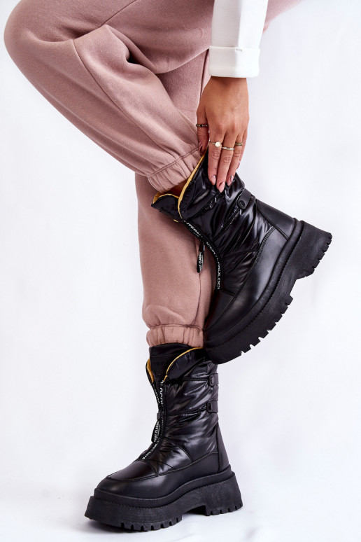 Bottes de neige noires avec... Bottes de neige noires avec...