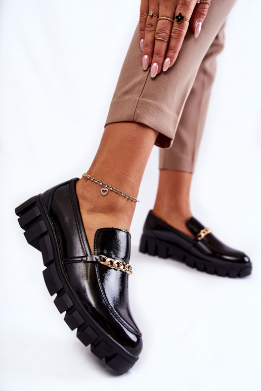 bottes en cuir verni avec chaînes en noir Anne