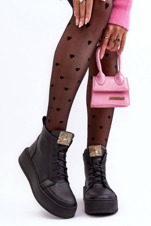 Enkellaarsjes met vetersluiting in de... Enkellaarsjes met vetersluiting in de...