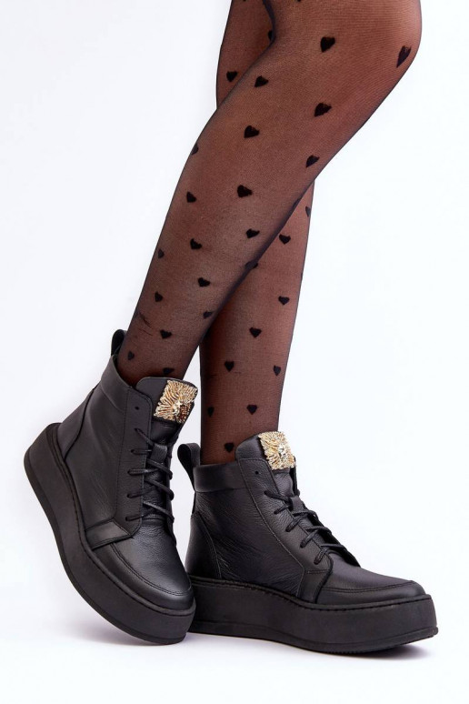 Enkellaarsjes met vetersluiting in de... Enkellaarsjes met vetersluiting in de...