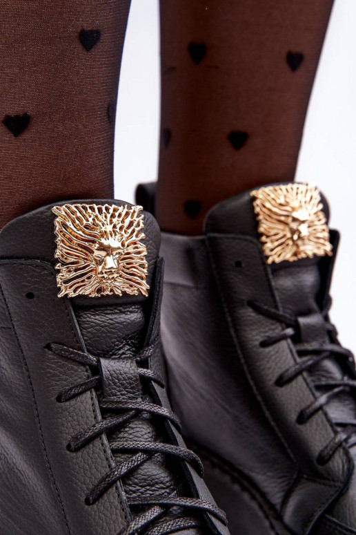 Enkellaarsjes met vetersluiting in de... Enkellaarsjes met vetersluiting in de...