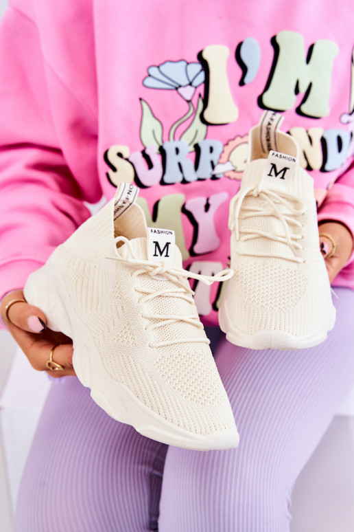 Chaussures modèle baskets en matière couleur ivoire Nolene