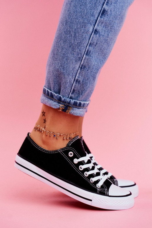 Chaussures décontractées modèle classique de couleur noire avec semelles blanches