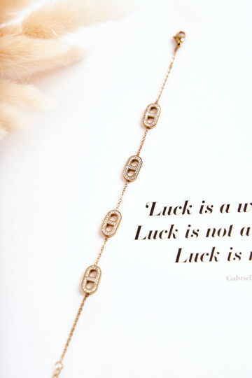 Damenarmband mit funkelnden Augen in Goldfarbe