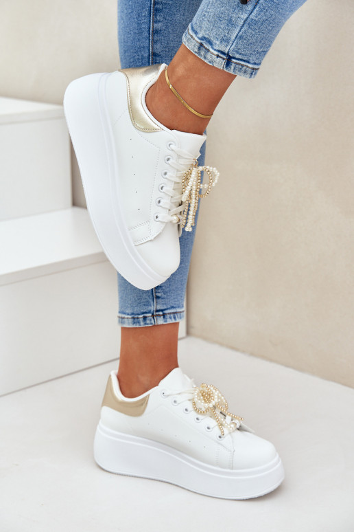 Sneakers model schoenen Dames met platform met mooie details INit-gouden kleur Lerissna