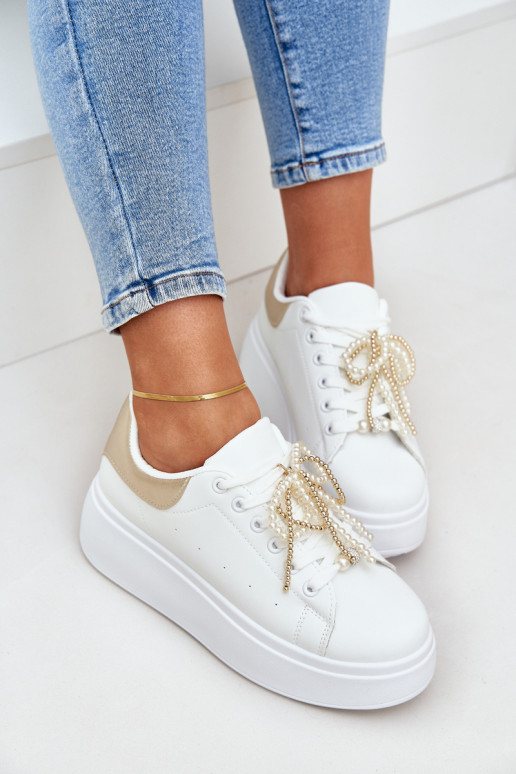 Sneakers model schoenen Dames met platform met mooie details INit-gouden kleur Lerissna