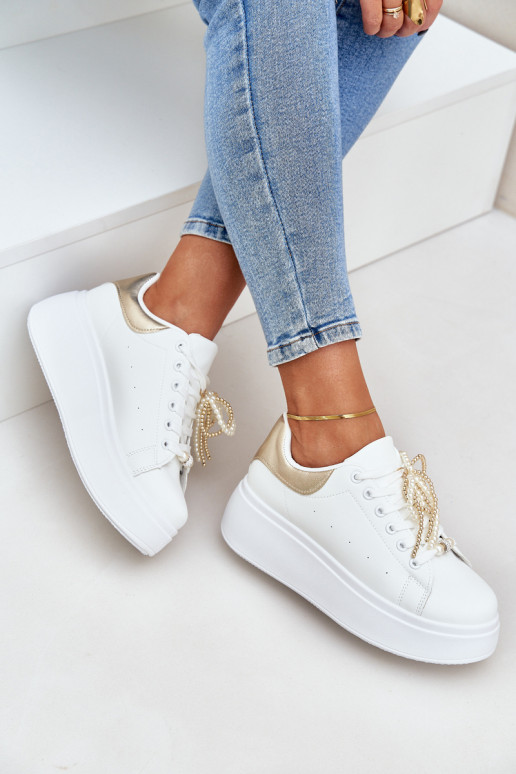 Sneakers model schoenen Dames met platform met mooie details INit-gouden kleur Lerissna